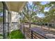 Cozy balcony with faux grass flooring and a view of the charming tree-lined street at 1801 N Morgan St # 6, Tampa, FL 33602