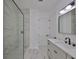 Bright bathroom with a glass shower and a modern vanity with black hardware at 1801 N Morgan St # 6, Tampa, FL 33602