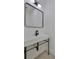 Sleek bathroom with a modern vanity, black faucet and a contemporary mirror at 1801 N Morgan St # 6, Tampa, FL 33602