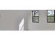 Bright bedroom with two windows overlooking a tree-lined street at 1801 N Morgan St # 6, Tampa, FL 33602
