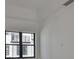 This bedroom offers a large window providing natural light and neighborhood views at 1801 N Morgan St # 6, Tampa, FL 33602