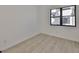 Bedroom featuring light-colored floors and a black-trimmed window at 1801 N Morgan St # 6, Tampa, FL 33602