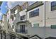 Exterior shot of multi-story condos featuring balconies and black framed windows on a sunny day at 1801 N Morgan St # 6, Tampa, FL 33602
