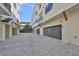 Exterior garage with paved driveway leading to multiple garages at 1801 N Morgan St # 6, Tampa, FL 33602