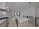 Kitchen area with white cabinets, a large kitchen island, and stainless steel appliances at 1801 N Morgan St # 6, Tampa, FL 33602