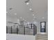 Open-concept kitchen with modern railing view to white cabinets, island, and stainless-steel appliances at 1801 N Morgan St # 6, Tampa, FL 33602