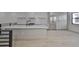 Kitchen with stainless steel appliances, white cabinets, island with seating and wood floors at 1801 N Morgan St # 6, Tampa, FL 33602