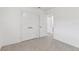 Bright, spacious bedroom with double closets offers ample storage and a clean, contemporary aesthetic at 1868 Douglas Ave, Dunedin, FL 34698