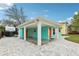 Charming home featuring a large open carport and modern architectural design at 1868 Douglas Ave, Dunedin, FL 34698