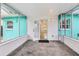 Enclosed outdoor patio providing a versatile space for relaxation and entertaining at 1868 Douglas Ave, Dunedin, FL 34698