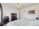 Bedroom featuring carpeted floors, ceiling fan, dresser with television, with a glimpse of the closet at 18822 Quarry Badger Rd, Land O Lakes, FL 34638