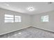 Cozy bedroom featuring carpet floors, light-grey walls and a view of the outdoors at 1915 Meridel Ave, Tampa, FL 33612