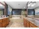 Luxurious bathroom with double vanities, soaking tub, and elegant tile at 19238 Climbing Aster Dr, Tampa, FL 33647
