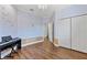 Spacious room with chandelier lighting, wood floors, and large closet at 19238 Climbing Aster Dr, Tampa, FL 33647