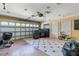 Large garage with tile flooring, garage door opener, and plenty of space for storage at 19238 Climbing Aster Dr, Tampa, FL 33647