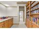 Hallway has custom cabinetry, granite countertops, and recessed lighting at 19238 Climbing Aster Dr, Tampa, FL 33647