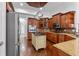 Spacious kitchen with stainless steel appliances, granite countertops, and a kitchen island at 19238 Climbing Aster Dr, Tampa, FL 33647