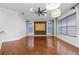 Open living room with large windows, fan, and neutral paint at 19238 Climbing Aster Dr, Tampa, FL 33647