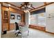 Bright office space with built-in shelves, a ceiling fan, and a nice view at 19238 Climbing Aster Dr, Tampa, FL 33647