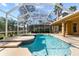 Screened-in pool area featuring a sparkling in-ground pool and spacious deck at 19238 Climbing Aster Dr, Tampa, FL 33647