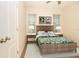 Bedroom featuring modern decor, bedside tables, and vertical blinds at 2166 Andrews Ct, Dunedin, FL 34698