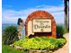 Welcome to Dunedin sign featuring a bagpiper statue and lush greenery against a beautiful waterfront backdrop at 2166 Andrews Ct, Dunedin, FL 34698