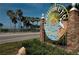 Charming sign welcomes visitors to Dunedin Causeway with sunny sky, palm trees and the bay in the background at 2166 Andrews Ct, Dunedin, FL 34698