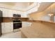 Close up of the kitchen showcasing granite countertops and stainless steel oven and microwave at 2166 Andrews Ct, Dunedin, FL 34698