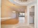 Open-concept living area featuring hardwood floors, vaulted ceilings, and views to the outdoor lanai at 2166 Andrews Ct, Dunedin, FL 34698