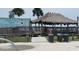 Charming beachside restaurant featuring a thatched roof and outdoor seating near the beach at 2166 Andrews Ct, Dunedin, FL 34698