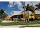 Lively restaurant exterior with a giant fish sculpture and colorful decor, near the coast, in Dunedin at 2166 Andrews Ct, Dunedin, FL 34698