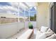 Relaxing screened-in porch with tile flooring, neutral furniture, and an outdoor view at 2166 Andrews Ct, Dunedin, FL 34698