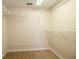 Spacious walk-in closet with wire shelving and carpeted floors at 2166 Andrews Ct, Dunedin, FL 34698