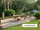 Community areas with a picnic table, chairs, and manicured grounds at 2210 Vista Del Sol Cir # 519, Lutz, FL 33558