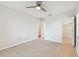 Spacious room with tile floors, a ceiling fan, closet, and ensuite doorway at 2301 Grenoble Pl # 1, Sun City Center, FL 33573