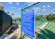 Clear signage displaying court etiquette rules in a fenced-in outdoor recreational area at 2301 Grenoble Pl # 1, Sun City Center, FL 33573