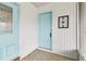 Inviting entryway with a bright blue front door and decorative details at 2301 Grenoble Pl # 1, Sun City Center, FL 33573