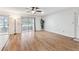 Spacious living room featuring wood floors, sliding glass doors, and ample natural light at 2301 Grenoble Pl # 1, Sun City Center, FL 33573