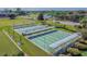 Aerial view of shuffleboard courts with benches, and coverings at a Florida community at 2301 Grenoble Pl # 1, Sun City Center, FL 33573