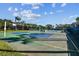Outdoor Volleyball court and a basketball hoop with a net, offering recreational activities for residents at 2301 Grenoble Pl # 1, Sun City Center, FL 33573