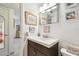 Bathroom featuring a sleek vanity, framed art, and neutral tones for a calming, modern space at 2458 Columbia Dr # 4, Clearwater, FL 33763