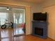 Living room view through the glass doors showing an adjacent room with natural light at 2462 Brazilia Dr # 76, Clearwater, FL 33763