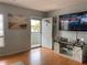 Cozy living room featuring wood flooring, a slider door, and stylish furnishings at 2462 Brazilia Dr # 76, Clearwater, FL 33763