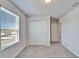 Bedroom with carpet flooring, closet, and a window at 3204 Fresno Pl, Zephyrhills, FL 33541