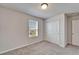 Carpeted bedroom with closet and window at 3204 Fresno Pl, Zephyrhills, FL 33541