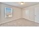 Carpeted bedroom with a window, a ceiling light, and a closet at 3204 Fresno Pl, Zephyrhills, FL 33541