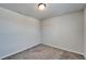 Simple bedroom with neutral carpet and white walls at 3204 Fresno Pl, Zephyrhills, FL 33541