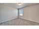 Bright bedroom with carpet, a neutral wall, and natural light from window at 3204 Fresno Pl, Zephyrhills, FL 33541