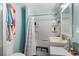 Clean bathroom with a shower-tub combo, well-lit vanity, and practical storage at 3307 S Manhattan Ave, Tampa, FL 33629