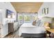 Comfortable bedroom with a wood ceiling, lots of natural light, and a cozy bed at 3307 S Manhattan Ave, Tampa, FL 33629